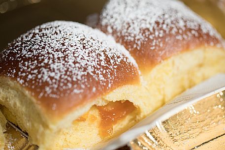 The typical Buchteln, cakes made of leavened dough, at the traditional festival of bread and strudel, Bressanone, Isarco valley, Trentino Alto Adige, Italy, Europe