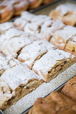 Strudel freshly baked at the festival of bread and strudel of Bressanone, Isarco valley, Trentino Alto Adige, Italy, Europe Strudel freshly baked at the festival of bread and strudel of Bressanone, Isarco valley, Trentino Alto Adige, Italy, Europe
