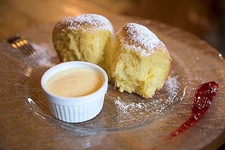 The Buchteln, cakes made with leavened dough typical of the Tyrolean tradition, Brixen, Isarco valley, South Tyrol, Italy, Europe The Buchteln, cakes made with leavened dough typical of the Tyrolean tradition, Brixen, Isarco valley, South Tyrol, Italy, Europe