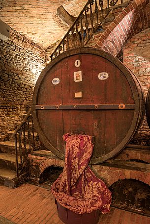 Wooden barrel in the historic wine cellar of Casa E. di Mirafiore e Fontanafredda in Serralunga d'Alba, Langhe, Piedmont, Italy, Europe Wooden barrel in the historic wine cellar of Casa E. di Mirafiore e Fontanafredda in Serralunga d'Alba, Langhe, Piedmont, Italy, Europe