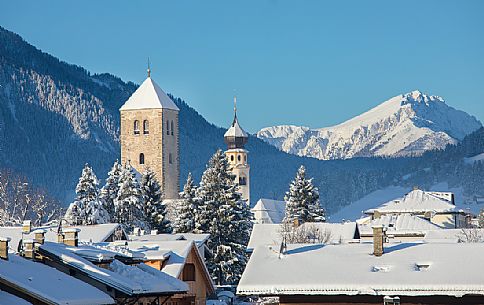 View over the roofs of San Candido with the Collegiata and the bell tower of the church of San Michele, Alta Pusteria, Trentino Alto Adige, Italy