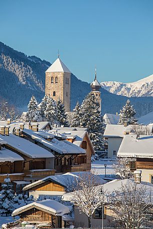View over the roofs of San Candido with the Collegiata and the bell tower of the church of San Michele, Alta Pusteria, Trentino Alto Adige, Italy