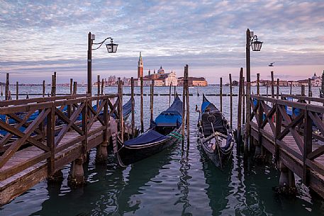 Venice Gondolas in Saint Marco Square with the Church of San Giorgio Maggiore on background, Venice, Italy, Europe Venice Gondolas in Saint Marco Square with the Church of San Giorgio Maggiore on background, Venice, Italy, Europe