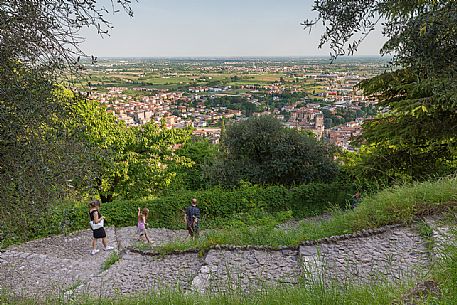 Tourists walk the promenade that leads from the Upper castle or Castello Superiore to the town of Marostica, Vicenza, Veneto, Italy, Europe