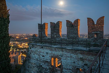 The towers of the Castello Superiore of Marostica by night and in the background the old town, Vicenza, Veneto, Italy