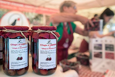 Cherry based products on sale in the stands of the Marostica Cherry Festival, Marostica, Vicenza, Veneto, Italy, Europe Cherry based products on sale in the stands of the Marostica Cherry Festival, Marostica, Vicenza, Veneto, Italy, Europe