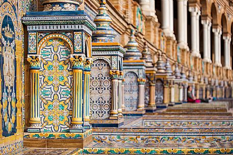 Benches and ceramic ornaments in the Plaza de Espana, one of the most spectacular architectural spaces in the city of Seville and neo-Moorish architecture, Seville, Spain, Europe Benches and ceramic ornaments in the Plaza de Espana, one of the most spectacular architectural spaces in the city of Seville and neo-Moorish architecture, Seville, Spain, Europe