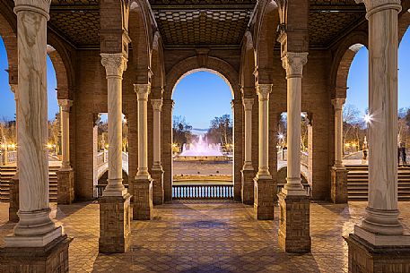 Sunlight and shadows through the pillars ot the Plaza de Espana, Seville, Andalusia, Spain, Europe