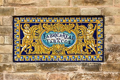 Sign of the Fabrica real De Tabacos, now part of the University of Seville, made of painted and glazed tiles, Seville, Andalusia, Spain, Europe