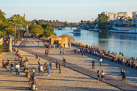 Tourists in the El Arenal district separated from the Triana district by the Guadalquivir river, Seville, Andalusia, Spain, Europe