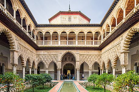 Patio de las Doncellas in the Real Alcazar palace, the lower part with plaster arches and stuccoes is in Mudejar style while the upper loggia shows the influence of the Italian Renaissance, Seville, Andalusia, Spain, Europe