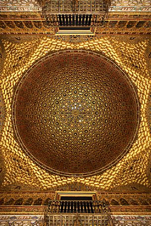 The dome of the Hall of Ambassadors, made of carved and gilded woven wood, in the Palace of the Real Alcazar, Seville, Andalusia, Spain, Europe The dome of the Hall of Ambassadors, made of carved and gilded woven wood, in the Palace of the Real Alcazar, Seville, Andalusia, Spain, Europe