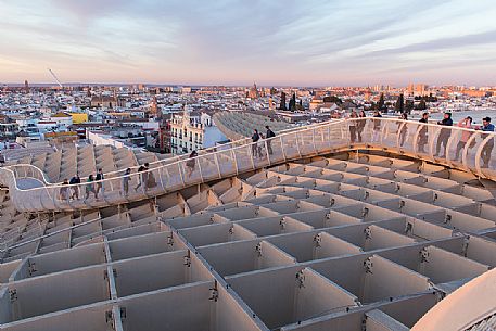 Sunset over the city of Seville from the roof of Metropol Parasol on plaza de la Encarnacion, commonly called Setas, a contemporary architecture project built entirely of wood, Seville, Andalusia, Spain, Europe