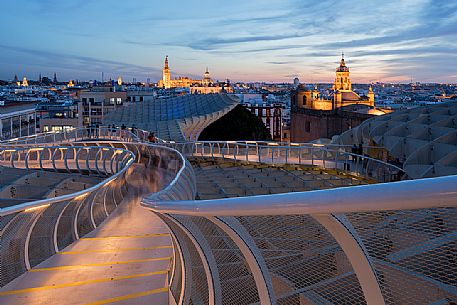 Sunset over the city of Seville from the roof of Metropol Parasol on plaza de la Encarnacion, commonly called Setas, a contemporary architecture project built entirely of wood, Seville, Andalusia, Spain, Europe