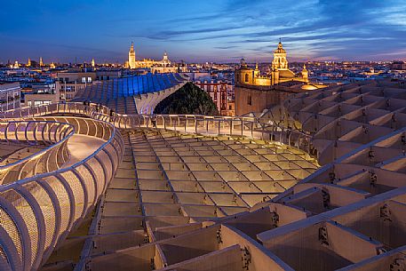 Sunset over the city of Seville from the roof of Metropol Parasol on plaza de la Encarnacion, commonly called Setas, a contemporary architecture project built entirely of wood, Seville, Andalusia, Spain, Europe