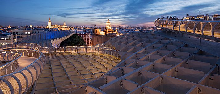 Sunset over the city of Seville from the roof of Metropol Parasol on plaza de la Encarnacion, commonly called Setas, a contemporary architecture project built entirely of wood, Seville, Andalusia, Spain, Europe