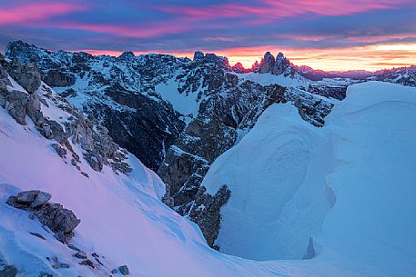 The Tre Cime di Lavaredo during a flaming dawn, photographed from the Picco di Vallandro over Prato Piazza valley in the Fanes Senes Braies natural park, dolomites, Pustertal, South Tyrol, Italy, Europe