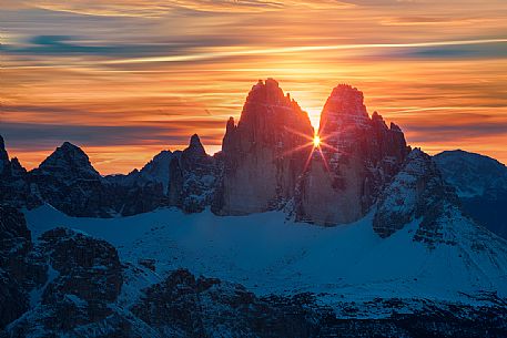 The sun rise between the Tre Cime di Lavaredo from the Picco di Vallandro over Prato Piazza valley in the Fanes Senes Braies natural park, dolomites, Pustertal, South Tyrol, Italy, Europe