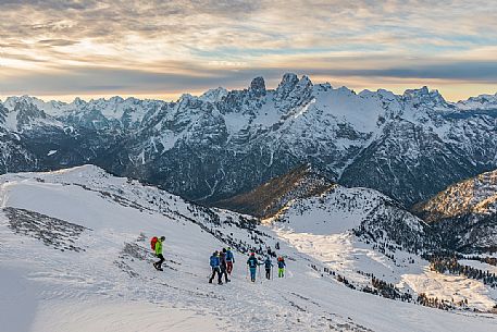 Hikers descend the mountain to Prato Piazza, on background Piz Popena and Cristallo Mount, Fanes Senes Braies Natural Park, Pustertal, dolomites, South Tyrol, Italy, Europe