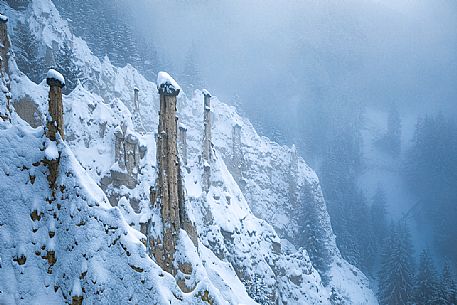 The Piramidi di terra or Earth Pyramids of the small village of Plata after an intensive snowfall, Perca, Pusteria valley, dolomites, Trentino Alto Adige, Italy, Europe The Piramidi di terra or Earth Pyramids of the small village of Plata after an intensive snowfall, Perca, Pusteria valley, dolomites, Trentino Alto Adige, Italy, Europe