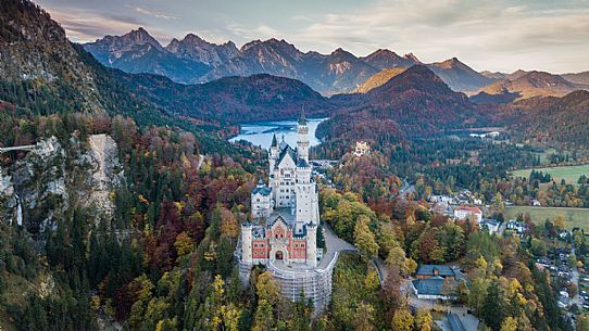 Neuschwanstein Castle, Schloss Neuschwanstein  and lake Alpsee against Tannheim Mountains in autumn, Schwangau near Fuessen, Bayern, Germany, Europe