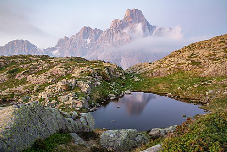 The Cimon della Pala peak reflected on the Cavallazza lake, Pale di San Martino group, San Martino di Castrozza, dolomites, Trentino Alto Adige, Italy, Europe