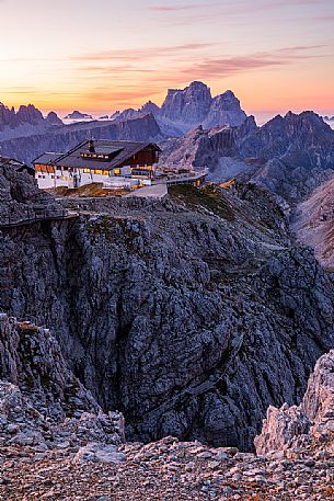 Lagazuoi Refuge with Pelmo Mount on background at dawn, Cortina d'Ampezzo, dolomites, Veneto, Italy 