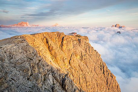 Panoramic view towards Lagazuoi refuge with Pelmo and Sorapiss peaks coming up from clouds, Cortina d'Ampezzo, dolomites, Veneto, Italy, Europe Panoramic view towards Lagazuoi refuge with Pelmo and Sorapiss peaks coming up from clouds, Cortina d'Ampezzo, dolomites, Veneto, Italy, Europe