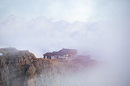 Lagazuoi refuge wrapped by fog, Cortina d'Ampezzo, dolomites, Veneto, Italy, Europe Lagazuoi refuge wrapped by fog, Cortina d'Ampezzo, dolomites, Veneto, Italy, Europe