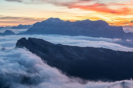 Clouds wrap around the landscape nearby Lagazuoi refuge, in the background the Sella mount, Cortina d'Ampezzo, dolomites, Veneto, Italy, Europe Clouds wrap around the landscape nearby Lagazuoi refuge, in the background the Sella mount, Cortina d'Ampezzo, dolomites, Veneto, Italy, Europe