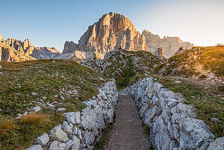 Trenches of the World War near Cinque Torri mount, on the background the Tofana di Rozes, Cortina d'Ampezzo, dolomites, Veneto, Italy, Europe Trenches of the World War near Cinque Torri mount, on the background the Tofana di Rozes, Cortina d'Ampezzo, dolomites, Veneto, Italy, Europe