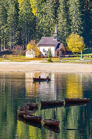 The Little church of Braies lake with autumn colors, dolomites, Pusteria valley, Trentino Alto Adige, Italy, Europe The Little church of Braies lake with autumn colors, dolomites, Pusteria valley, Trentino Alto Adige, Italy, Europe