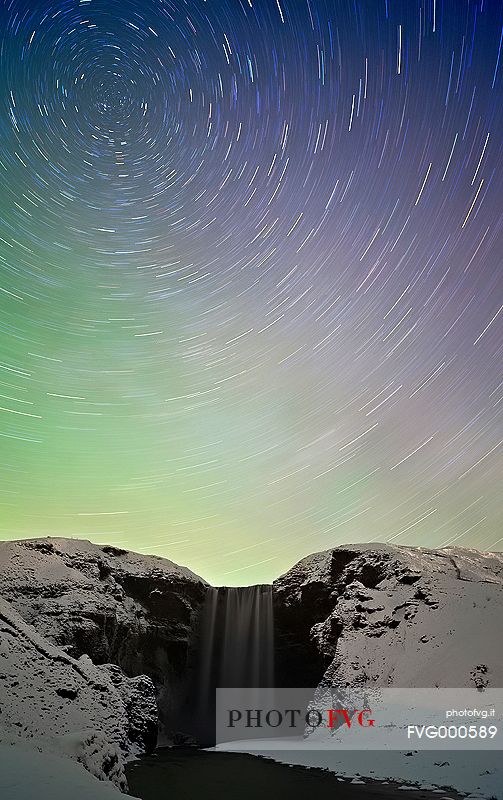 Star trail caught above Skogafoss at night time.