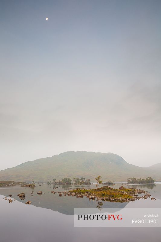 Misty morning and moon at loch na claise