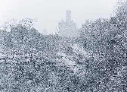 Scottish castle under a strong snow storm