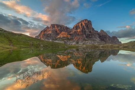 The warm light of sunset kissed the mountains on the background