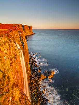 The most famous waterfall on the Isle skye portraited during the sunrise