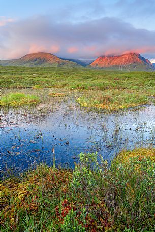 A sunny morning and warm light on the peak of the hills