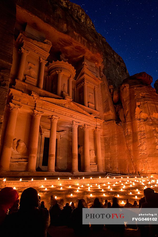 Bedouin's Candle lights show at the bottom of the Al Khazneh or Treasury at night in Petra, Jordan