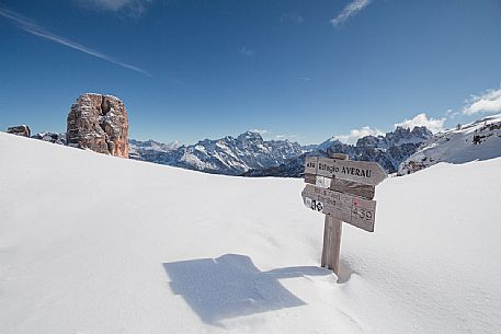 Sign along the path to the Cinque Torri peaks in a sunny winter day, Dolomites, Cortina d'Ampezzo, Cadore, Veneto, Italy, Europe