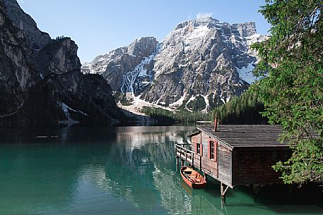 Wooden cabin on the alpine lake of Braies, Pragser lake, Croda dal Becco mountain in the background, Pragser, South Tyrol, Dolomies,iItaly, Europe