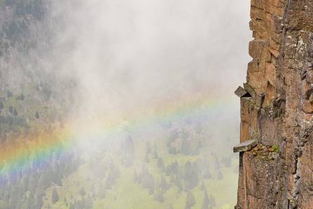 rainbow slides over the rocks