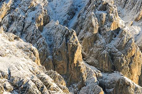 The dawn sun warms the rocks still white washed