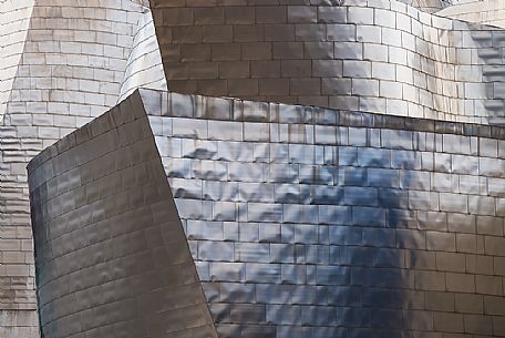 Details of Guggenheim museum in Bilbao. With its interesting color and texture of the walls, great is the contrast between the sharp edges and curved surfaces, Bilbao, Spain