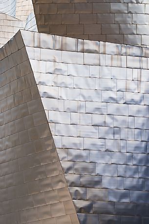 Details of Guggenheim museum in Bilbao. With its interesting color and texture of the walls, great is the contrast between the sharp edges and curved surfaces, Bilbao, Spain