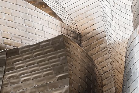 Details of Guggenheim museum in Bilbao. With its interesting color and texture of the walls, great is the contrast between the sharp edges and curved surfaces, Bilbao, Spain