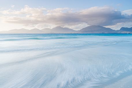 Sunset on Luskentyre beach in the Outer Hebrides on the Isle of Harris, Scotland.