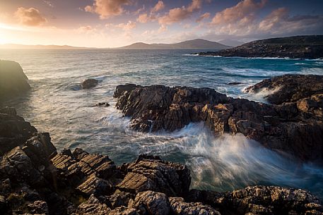 Sunset on the rocks near Na-Buirgh in the Outer Hebrides on the Isle of Harris, Scotland.