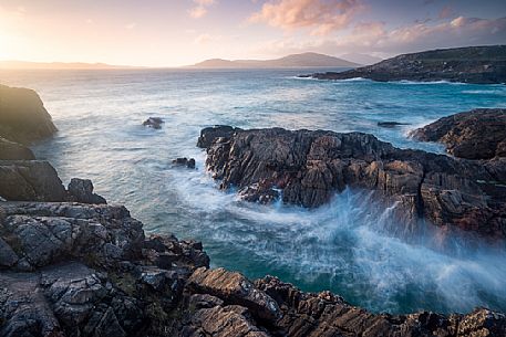 Sunset on the rocks near Na-Buirgh in the Outer Hebrides on the Isle of Harris, Scotland.