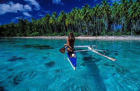 Woman on canoe, Moorea, Tahiti island, French Polynesia
